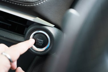 Engine start stop button in modern car. Close up