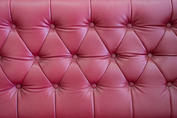 Red sofa background and texture. Red diamond pattern upholstery background
