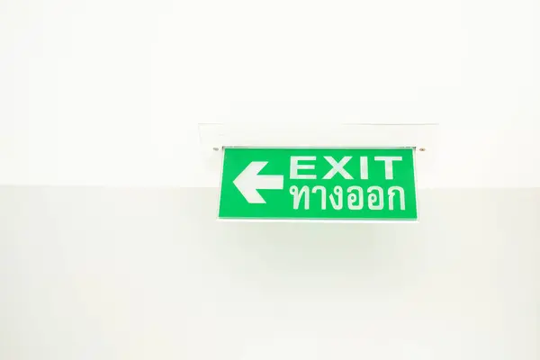 Green emergency exit sign green light box. Thai Letter is Thai Language mean EXIT. Emergency Exit