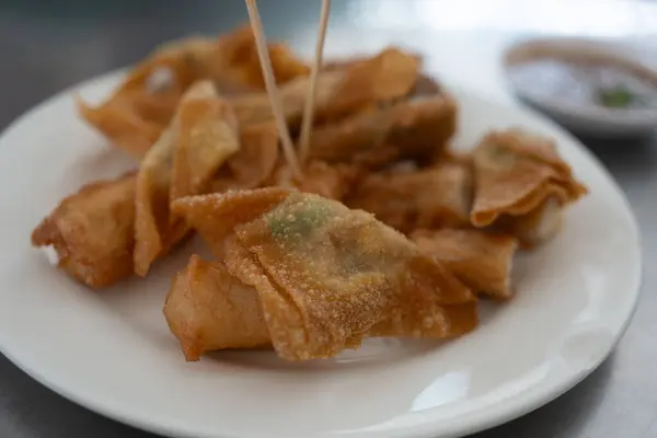 Easy recipe, snacks, minced pork meat filled fried wontons. Asian Style food appetizer