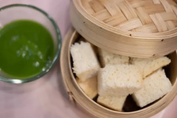 Slice steamed bread and pandan custard wonderful fragrance and taste. It commonly eaten with hot beverages.