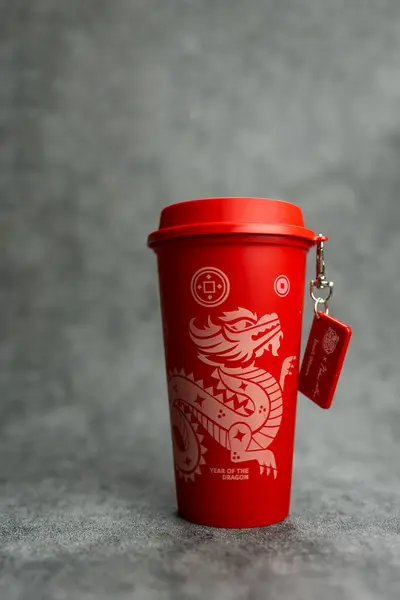 stock image Bangkok, Thailand - June 24, 2024 : A red reusable cup from Cafe Amazon, Get power to enhance your luck with cup name of Dragon pattern. Get 1 free Dragon Reusable Cup in June 24, 2024