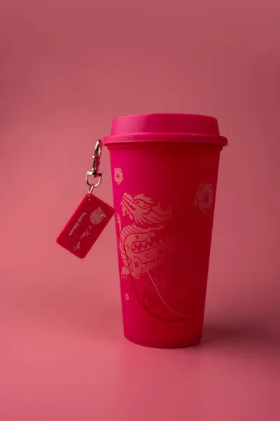 stock image Bangkok, Thailand - June 30, 2024 : A pink reusable cup from Cafe Amazon, Get power to enhance your luck with cup name of Dragon pattern. Get 1 free Dragon Reusable Cup in June 25, 2024