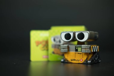 Bangkok, Thailand - October 21, 2024 : Wall E toy, Disney, Pixar POP CUBE 1 Series figures from pop mart on a black background clipart