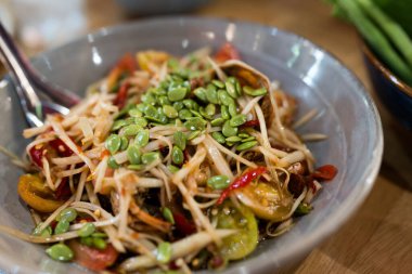 Papaya salad with crab and fermented fish decoration seed Acacia, a popular food among Thai people clipart