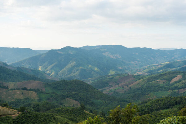 Aerial view. High mountain views and the verdant farmland of the countryside in  Sakat, Pua District, Nan, Thailand