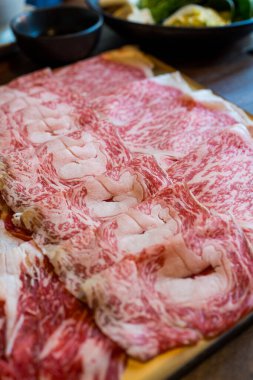 Close up shot of sliced marble wagyu meat for shabu shabu hot pot