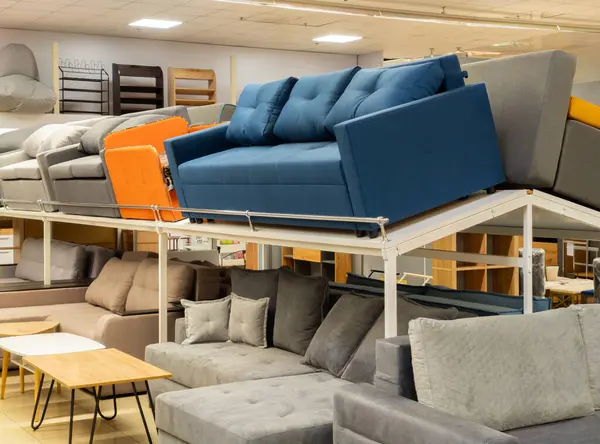 Furniture store with sofas and couches on display for sale, copy space. Showroom in the upholstered furniture store department with sofas and couches.