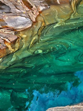 Verazca River - flowing water over polished stone clipart