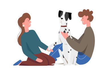 Köpekli bir çift yerde oturuyor, yavru köpek pençesi çizimi tutan bir kız.