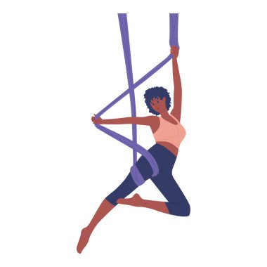 Bir hava yogası uygulayıcısı canlı ve enerjik bir atmosferde inanılmaz esneklik ve güç sergiliyor.