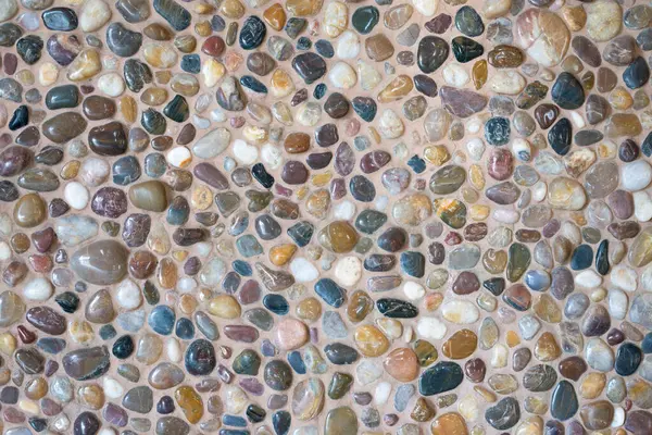 Polished beige cool colors pebble stone seamless wall decoration texture. Sea floor gravel pebble stone wall decoration