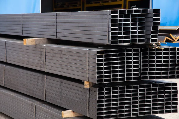 stock image Metal profile pipe of rectangular cross section in packs at the warehouse of metal products