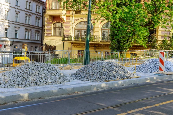 stock image A pile of European square white paving stones at a construction site in Prague, Czech Republic. Construction of sidewalks.