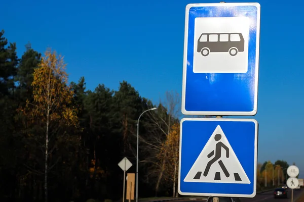 International road signs \'Bus stop\' \'Pedestrian crossing\'
