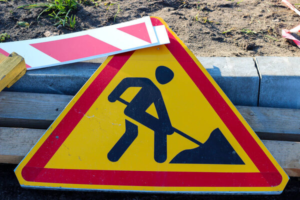 Broken dirty road sign 'Repair works'