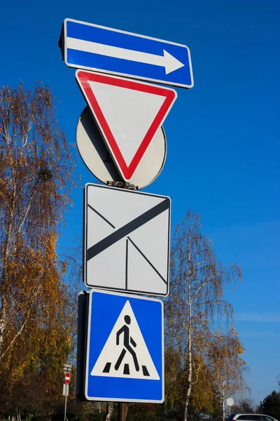 International traffic signs \'Give way\' \'The way of priority road\'  \'Pedestrian crossing\' and sign which indicate the direction right