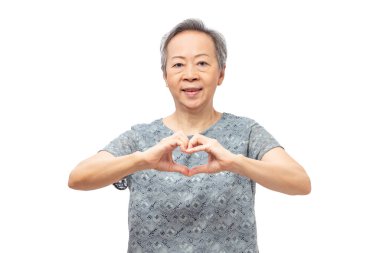 Senior asian woman showing heart hand sign with smile isolated on white background