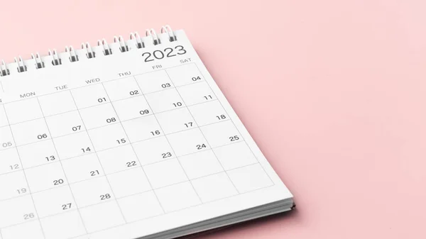 Calendar 2023 on pastel pink background, appointment meeting or planning and scheduling concept