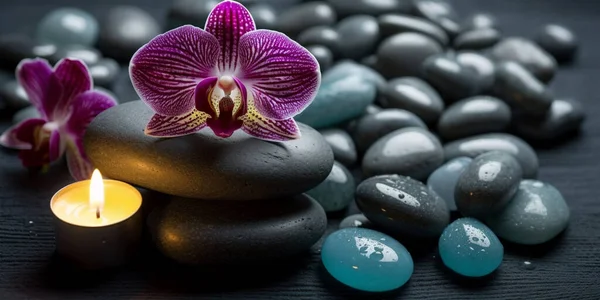 Background of spa center towel candle orchid and massage stones