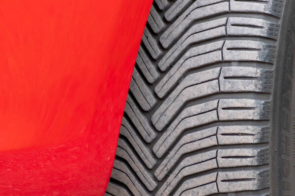Close up of tyre of red car