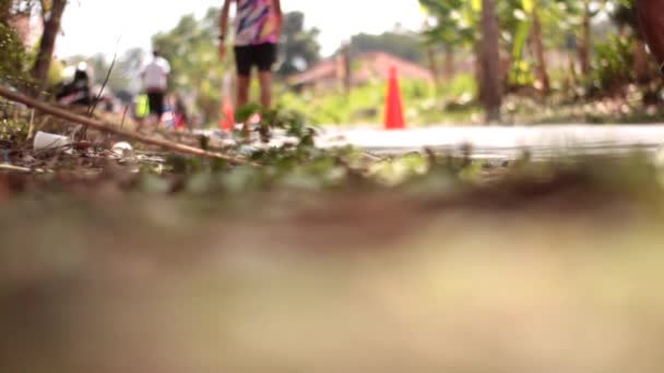 2023 Marathon Runners Passing Village Road — Stock Video