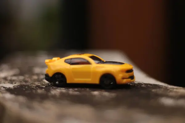 photo of a car race toy car with a blurred background.