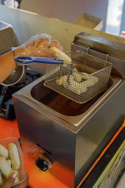 stock image Otak Otak Lumpia is put into a basket to be fried