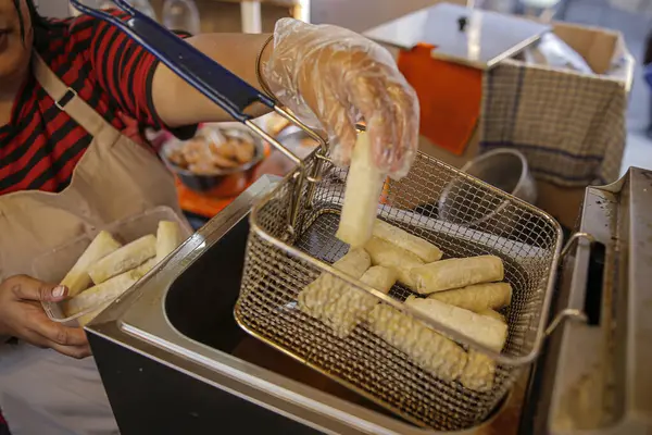 stock image A chef is frying Lumpia Otak-Otak which is about to be fried