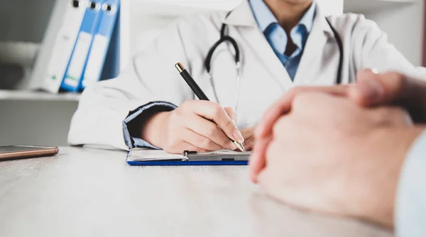 stock image doctor hand pen with ill in room background