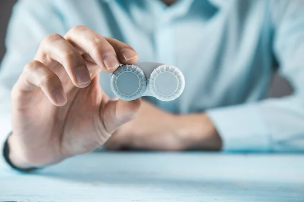Man Hand Optic Lenses Blue Table Background — Stock Photo, Image