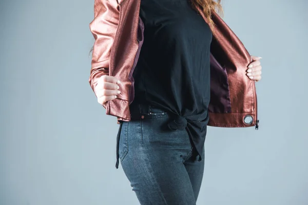 stock image woman hand in jacket on the grey background