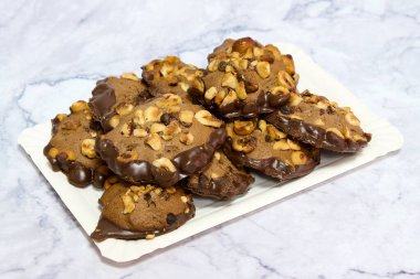 tray with homemade chocolate and almond cookies