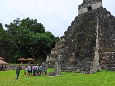 Gathering of Explorers: Tourists in Front of Temple I, Tikal, Peten, Guatemala clipart