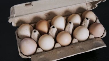 Demonstration of an open tray with eggs. Close-up