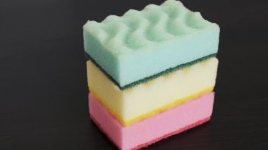 Demonstration of colorful kitchen sponges. Close-up