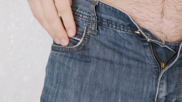 Man Pulls Out Condom Front Pocket His Jeans Close — Vídeos de Stock