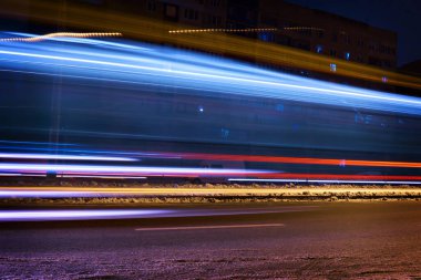 Ukraine - winter, the city during a blackout, after Russian missile strikes on the country's energy sector. Light glare from cars and public transport. Close-up.