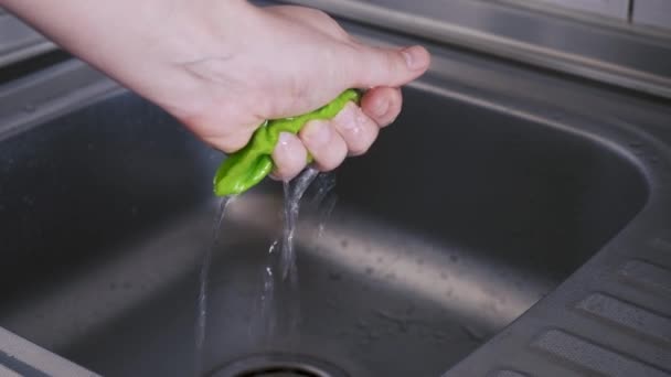 Man Hand Squeezes Water Water Absorbing Napkin Stainless Steel Sink — Stock Video