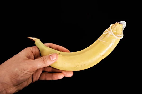 Μπανάνα Προφυλακτικό Απομονωμένη Σκούρο Φόντο — Φωτογραφία Αρχείου