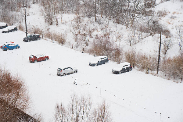 Snow in the open air parking lot. View from above.