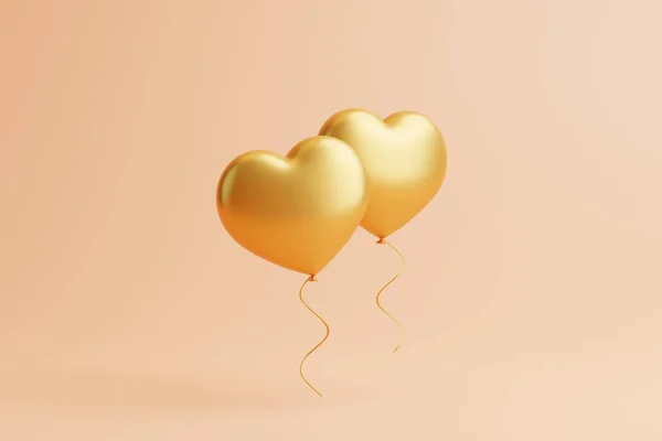 Two Gold Heart Shaped Balloons Isolated Peach Background Valentine Day — Stock Photo, Image