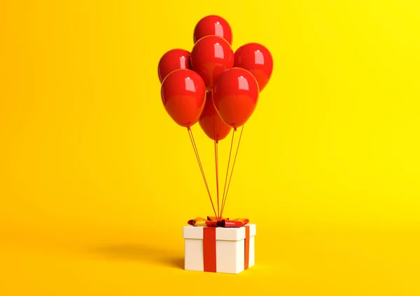 Kırmızı Kurdeleli Beyaz Hediye Kutusu Pastel Sarı Arka Planda Balon — Stok fotoğraf