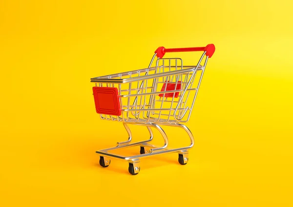 黄色の背景にショッピングカート ショッピング トローリー 食料品の押しカート ミニマリストのコンセプトは 孤立したカート 3Dレンダリング図 — ストック写真