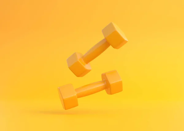 Dois Halteres Borracha Plástico Amarelo Revestido Fitness Caindo Sobre Fundo — Fotografia de Stock
