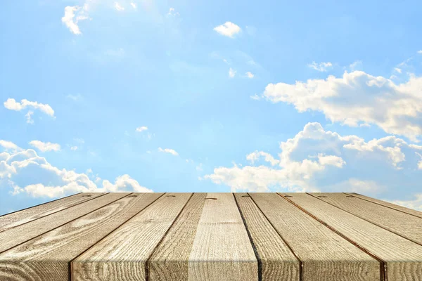 stock image Ecology background: empty wood planks desk on blue sky background.