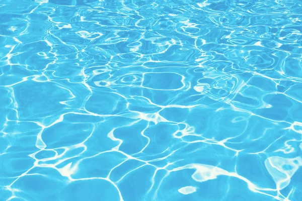 stock image swimming pool with water and sun reflections