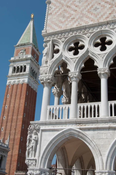 stock image Close-up view on architectural details of Saint Mark's bell tower and hystoric Palace of the Doges in Venice