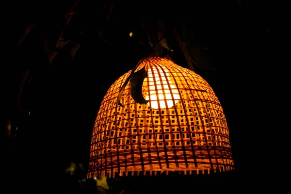 Interior decoration furniture and lighting ceiling hanging lamp with bamboo wicker weave on roof in room of classic retro vintage coffee shop for travelers travel visit and relax in Bangkok, Thailand