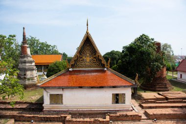 Ancient building ubosot of Wat Phra Si Rattana Mahathat temple for thai people travelers visit and respect praying blessing wish holy mystery worship buddha at Suphanburi city in Suphan Buri, Thailand